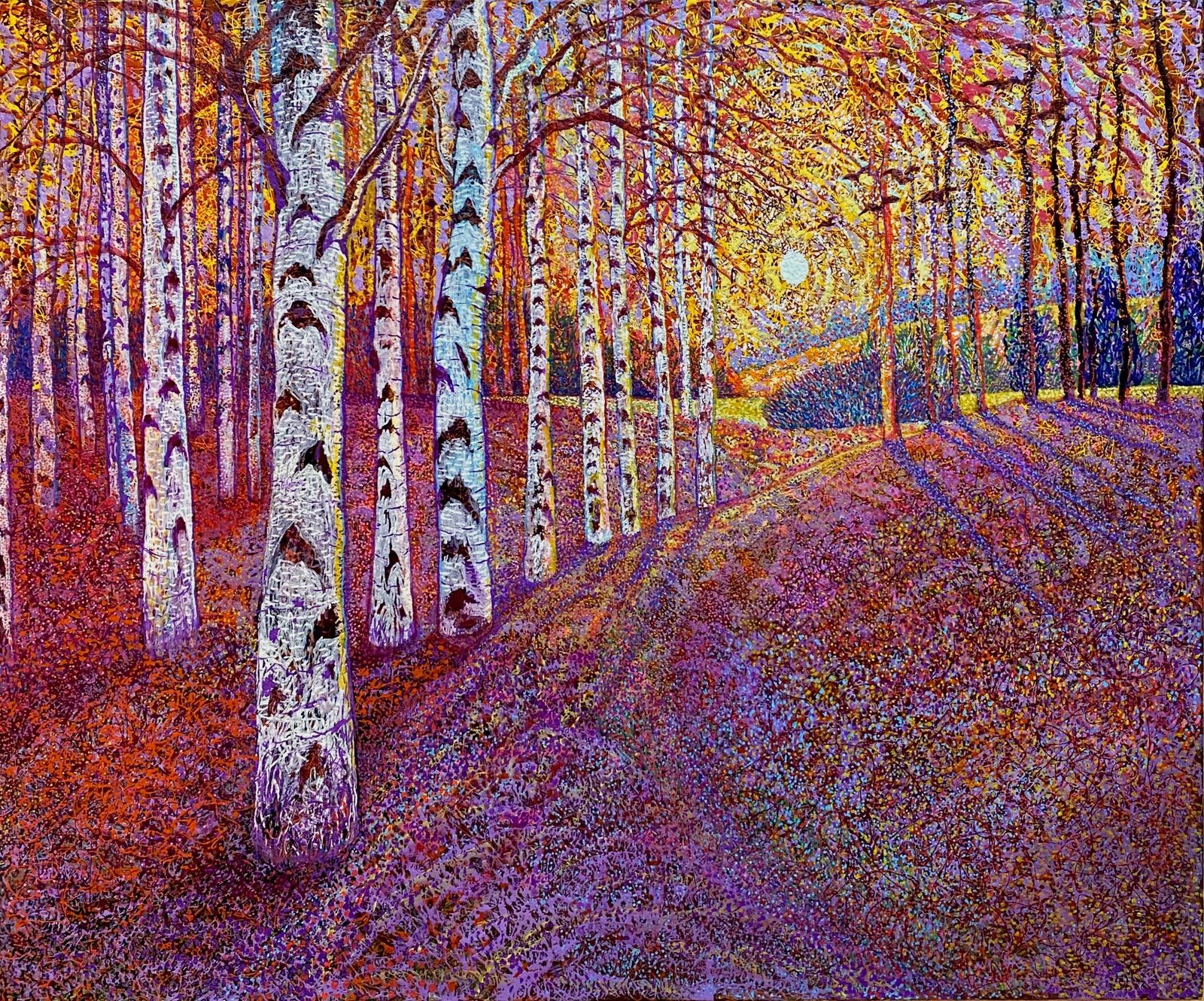 Birch tree sunset shown on a living room wall
