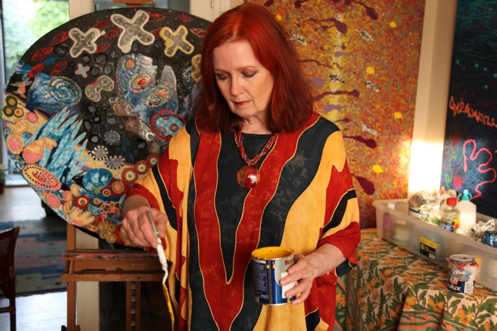 Donna White painting in her studio